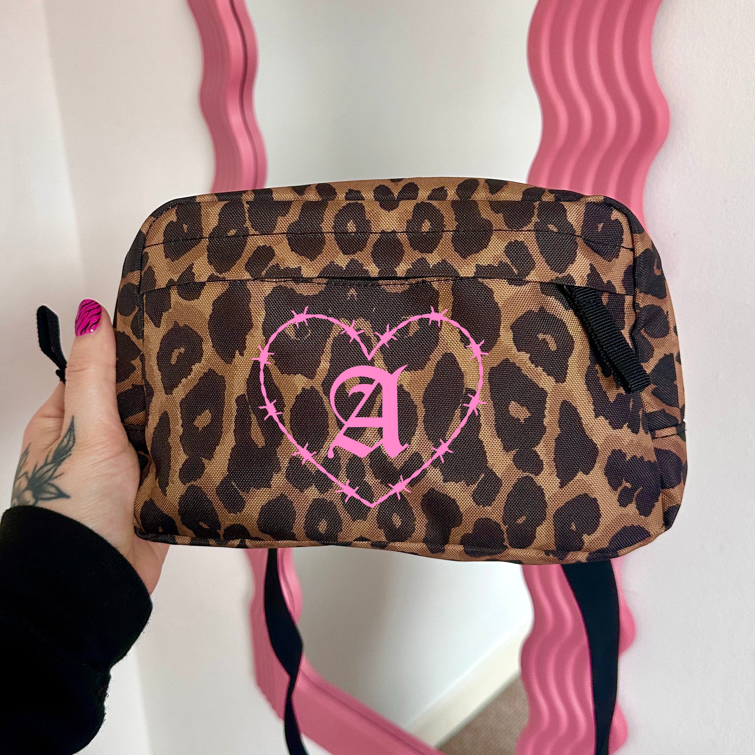 BARBED INITIAL LEOPARD CROSS BODY BAG